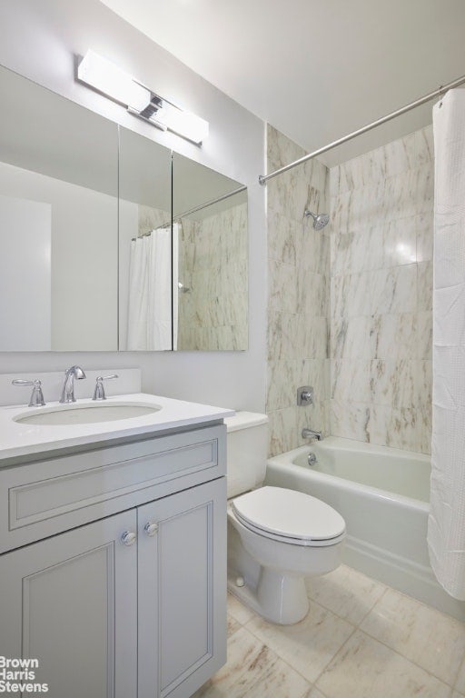 full bathroom with toilet, vanity, and shower / bath combo with shower curtain