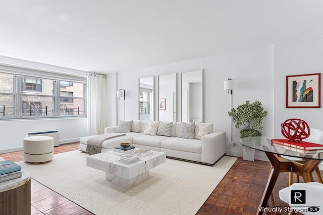 living room featuring parquet floors