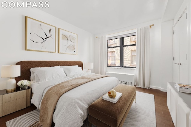 bedroom featuring dark hardwood / wood-style flooring