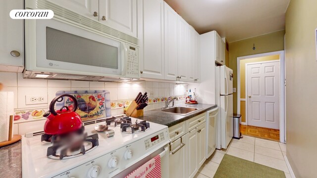 full bathroom featuring sink, tile walls, toilet, and shower / bath combination with curtain