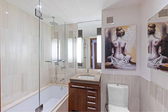 full bathroom with visible vents, a combined bath / shower with rainfall shower, toilet, and vanity