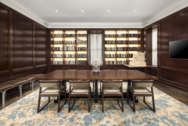 interior space with wood finished floors and crown molding