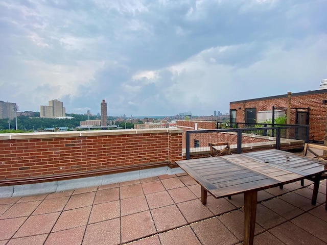 view of patio / terrace featuring a view of city