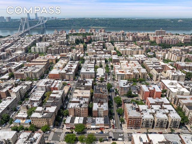 bird's eye view featuring a view of city and a water view