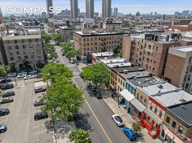 birds eye view of property with a view of city