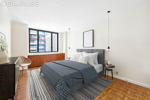 bedroom with parquet flooring and ornamental molding