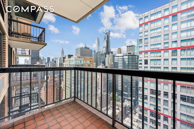 balcony featuring a skyline view