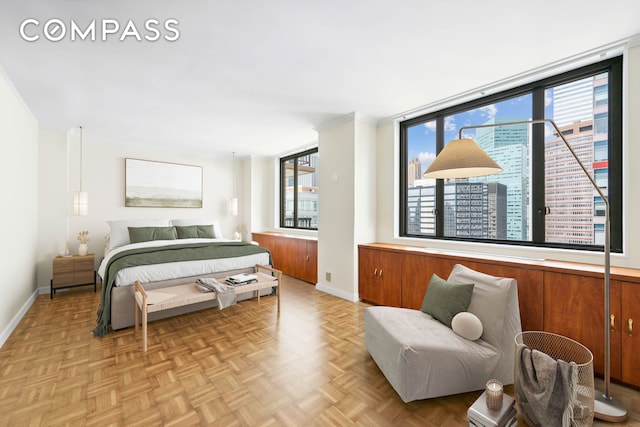 bedroom featuring multiple windows and baseboards