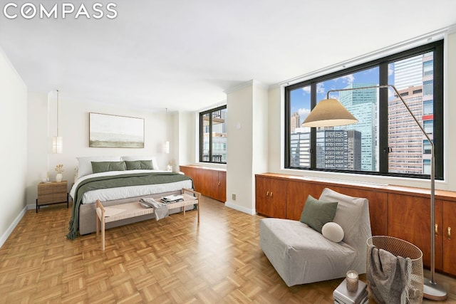 bedroom with light parquet flooring