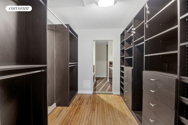 spacious closet with wood finished floors