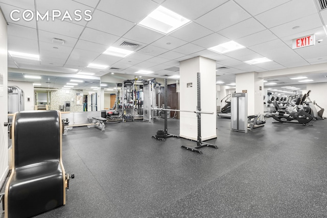 gym with visible vents and a drop ceiling