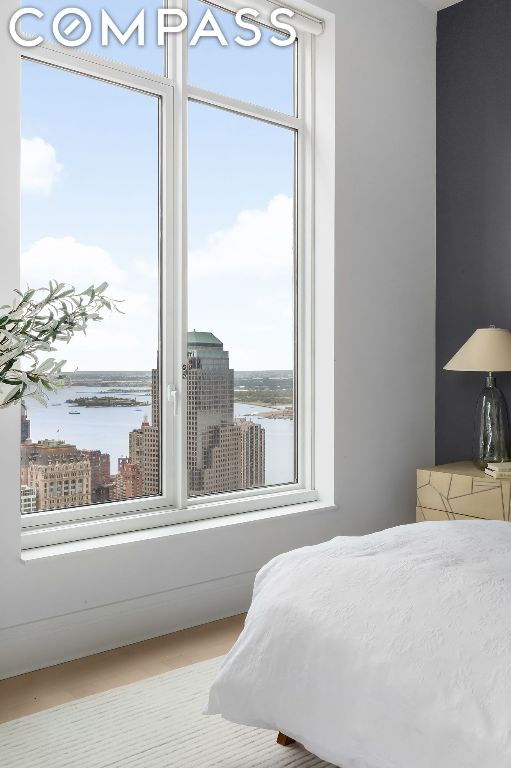 bedroom featuring a water view