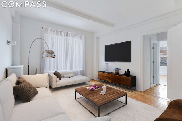 living room with beamed ceiling and light parquet floors