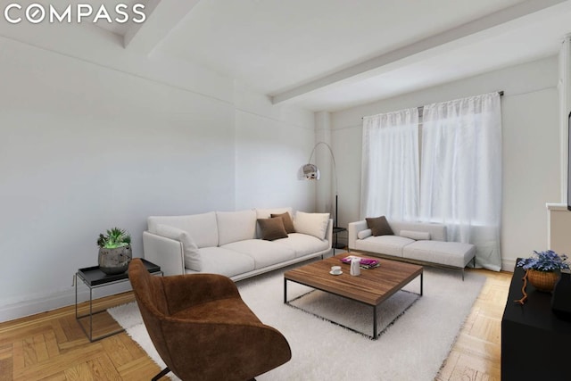 living room with beamed ceiling and light parquet flooring