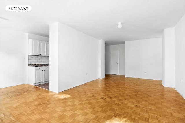 spare room with light parquet floors