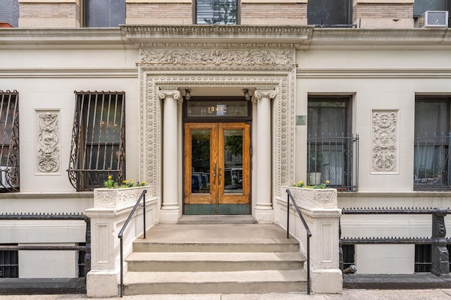 view of exterior entry featuring french doors