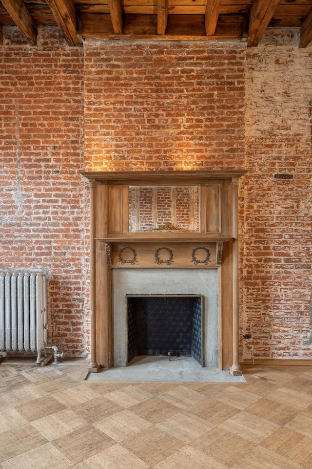 room details featuring a fireplace, radiator heating unit, and tile patterned floors