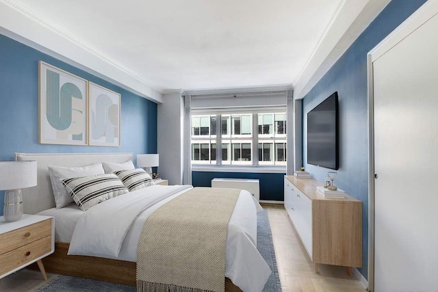 bedroom featuring crown molding