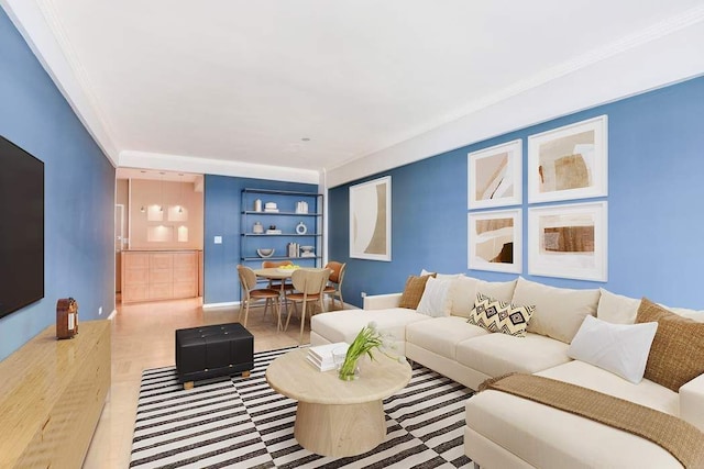 living room with built in features and ornamental molding