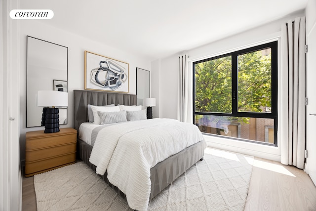 bedroom with light hardwood / wood-style flooring