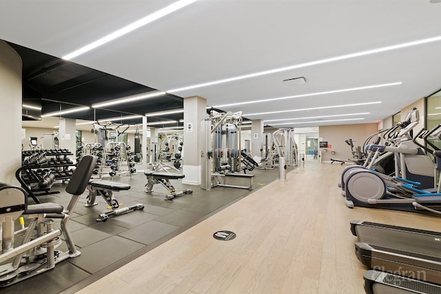 workout area featuring hardwood / wood-style flooring