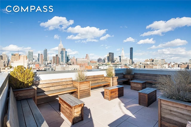 view of patio featuring a city view and outdoor lounge area