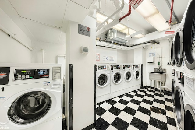 washroom with sink and washing machine and dryer