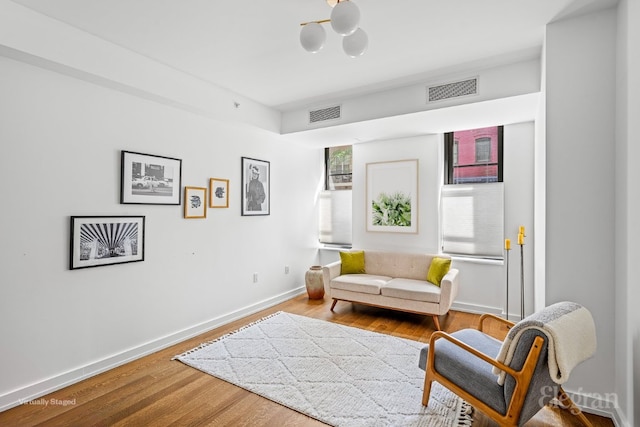 living area with hardwood / wood-style floors