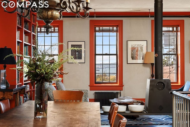 dining space featuring radiator and a healthy amount of sunlight