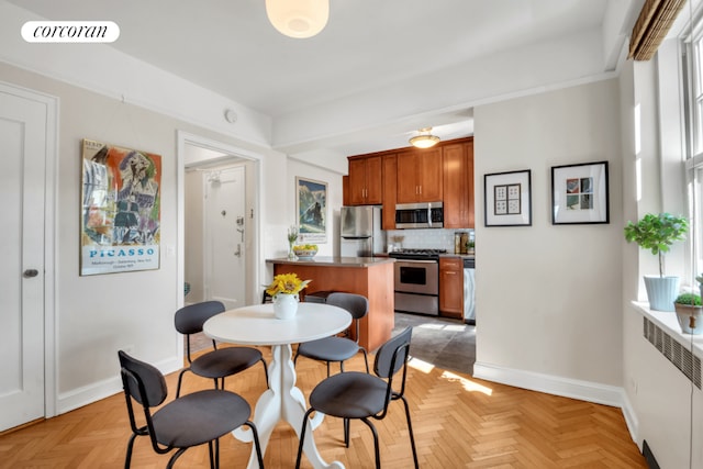 dining room with light parquet flooring