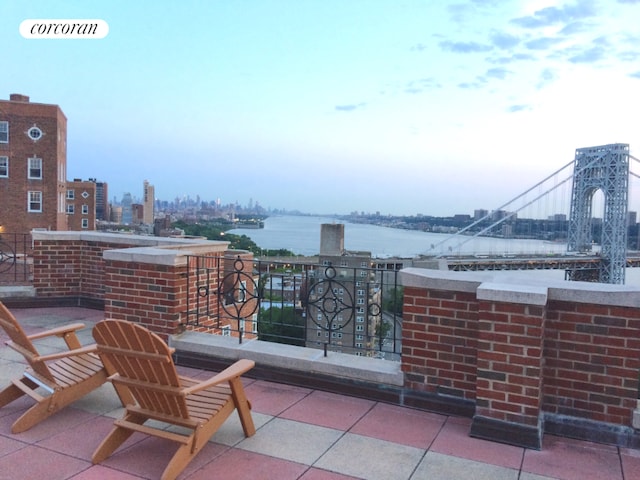 view of patio with a water view