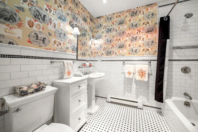 bathroom featuring toilet, tile walls, shower / bath combo, and a baseboard heating unit