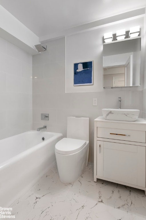 full bathroom with toilet, shower / bathtub combination, vanity, and tile walls