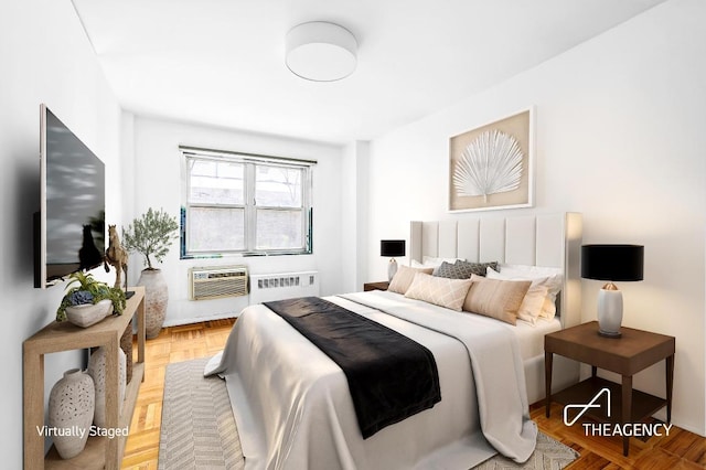 bedroom featuring radiator and a wall mounted AC