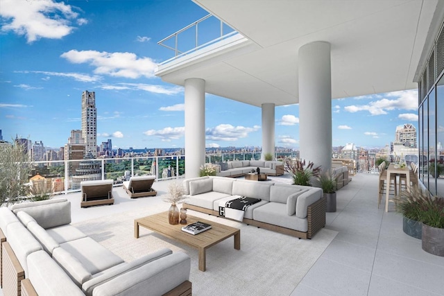 view of patio featuring an outdoor living space and a balcony