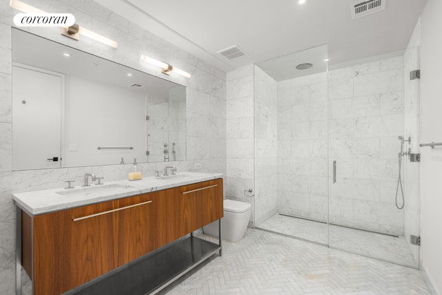 bathroom featuring vanity, tile walls, toilet, and an enclosed shower