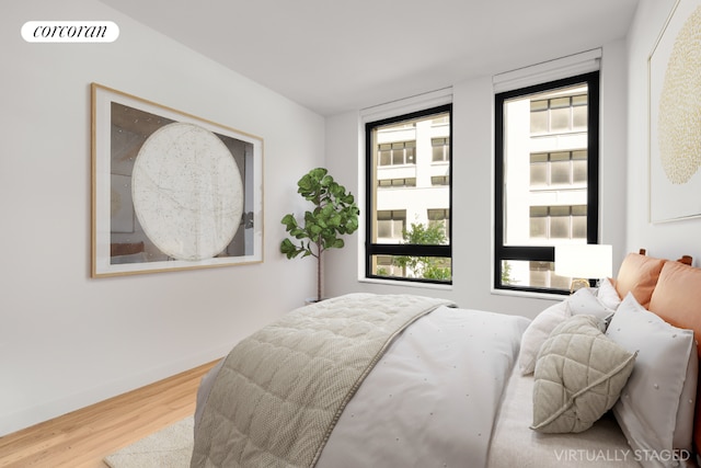 bedroom with hardwood / wood-style floors