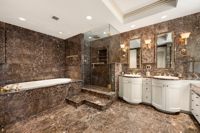 full bath featuring marble finish floor, a stall shower, and tile walls