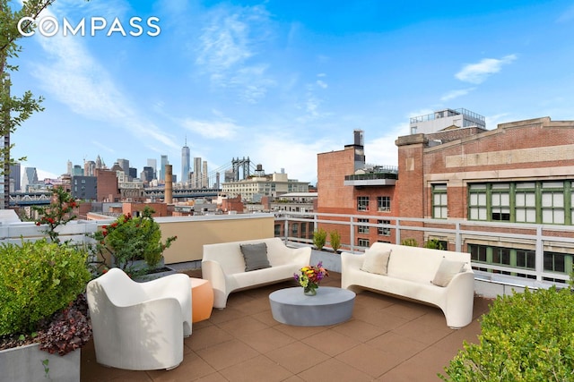 view of patio / terrace featuring a view of city and an outdoor living space