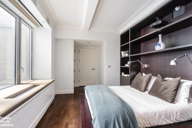 bedroom featuring dark wood-type flooring, multiple windows, beam ceiling, and baseboards