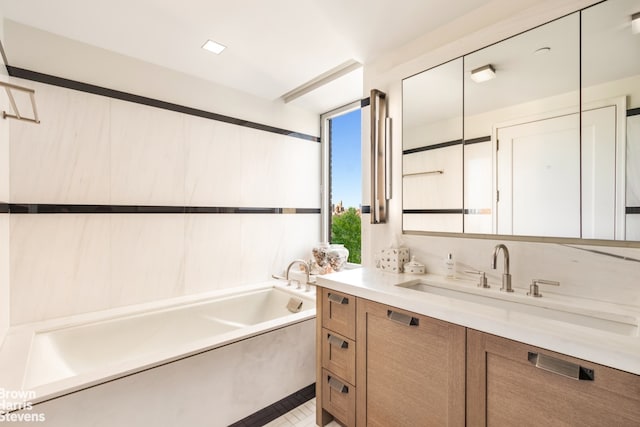 bathroom featuring vanity and a bathtub