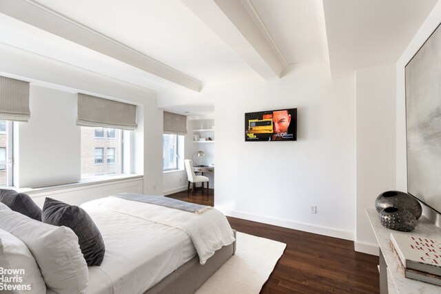 bedroom featuring beamed ceiling, baseboards, and dark wood-type flooring