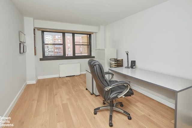 office area with light hardwood / wood-style flooring