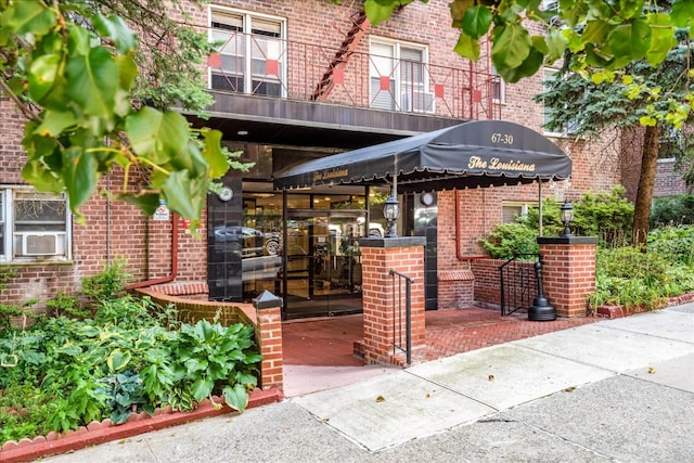 exterior space with brick siding