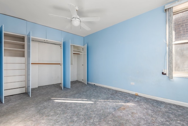 unfurnished bedroom with carpet, a ceiling fan, and baseboards