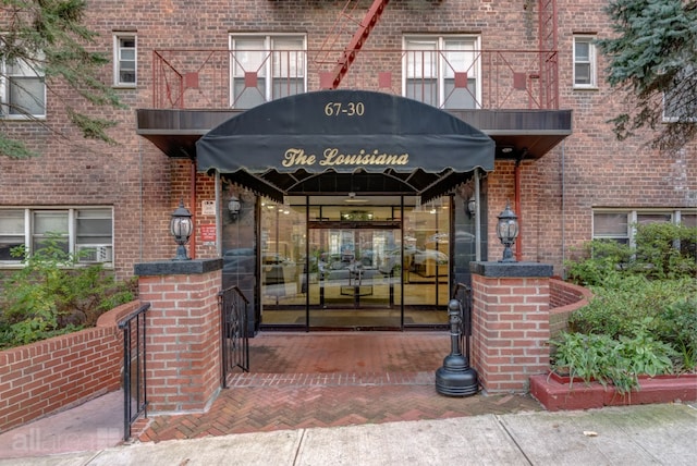 property entrance with brick siding