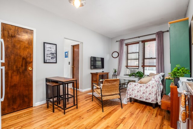 sitting room with light wood-style flooring and baseboards