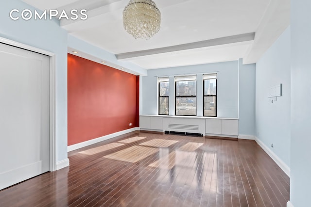 interior space with beamed ceiling, wood finished floors, baseboards, and a chandelier