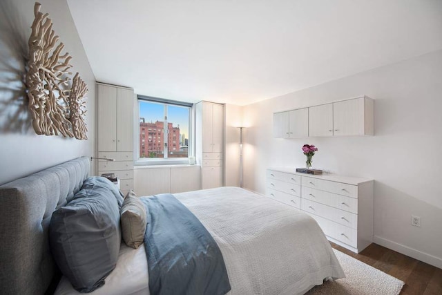 bedroom featuring dark hardwood / wood-style flooring