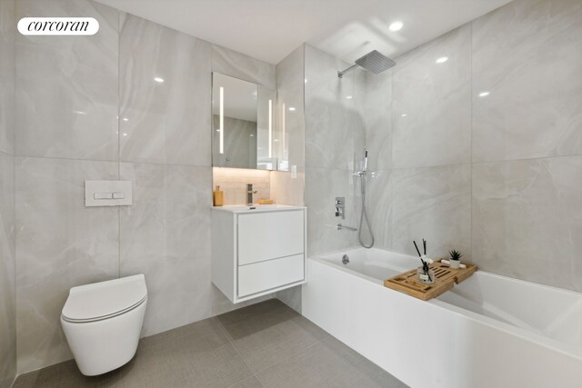 bathroom with vanity, visible vents, toilet, tile walls, and tile patterned floors